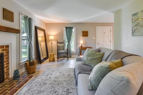 a living room with a couch and a fireplace at Tranquil Cottage in Virginia Countryside with Pond! in Midlothian