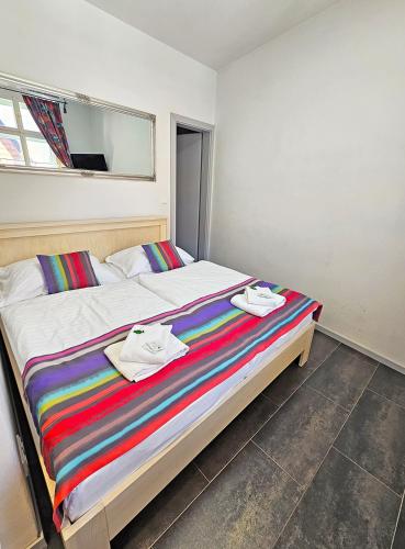 a bedroom with a bed with towels on it at Historic Centre Residence in Prague