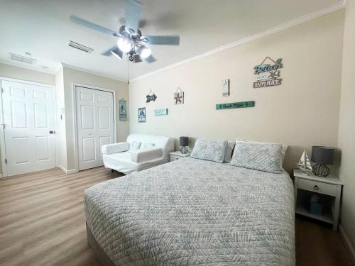 a bedroom with a bed and a ceiling fan at Private Suite with Private Gym&Patio, Minutes to Beaches, Up to 4 Guests in Largo