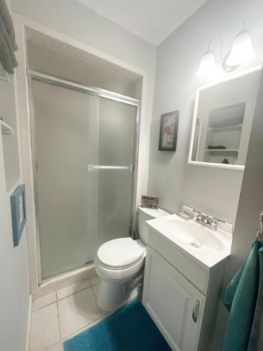 a bathroom with a shower and a toilet and a sink at Private Suite with Private Gym&Patio, Minutes to Beaches, Up to 4 Guests in Largo