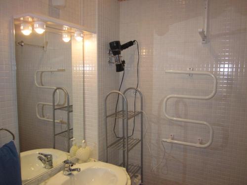 a bathroom with a shower with a sink and a mirror at 0318 Studio in Torremolinos 800 m from the beach in Torremolinos