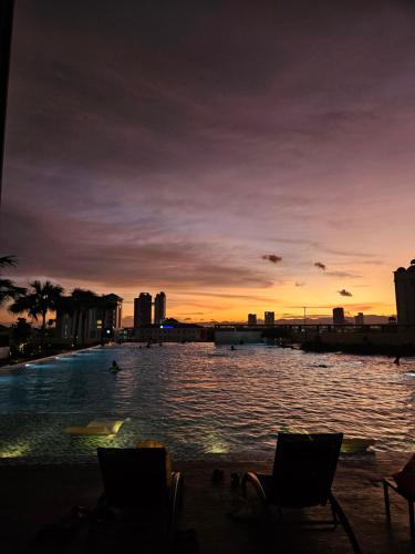 a view of a body of water at sunset at METROPOL SERVICED APARTMENT at Bukit Mertajam, Pulau Pinang in Bukit Mertajam