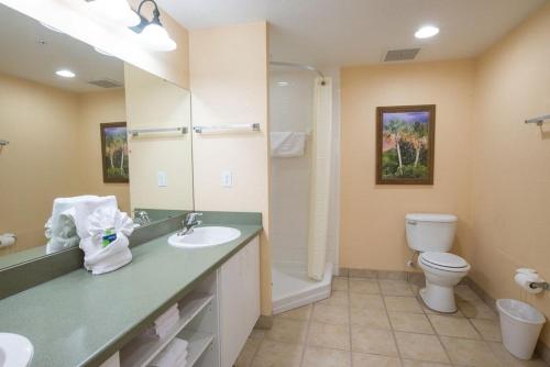a bathroom with a sink and a toilet at Vacation Village at Parkway in Orlando