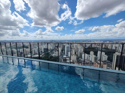 a swimming pool with a view of a city at ID Vida Urbana Setor Oeste Goiânia 3703A in Goiânia