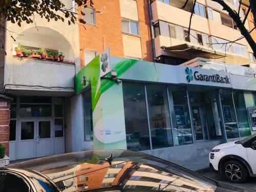 a car parked in front of a building at Apartament Diana in Tulcea