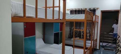 a group of bunk beds in a room at Hostel Rococo Pelton Palolem Beach in Canacona