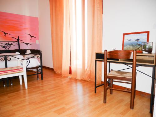 a dining room with a table and a chair at B&B Al Vecchio Pontile Sea View in Marsala