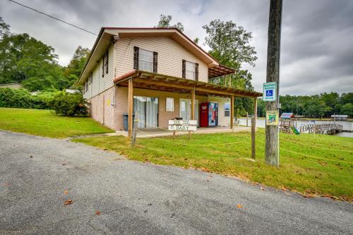 a small house on the side of a road at Eufaula Retreat Community Pool and Screened Porch! in Eufaula