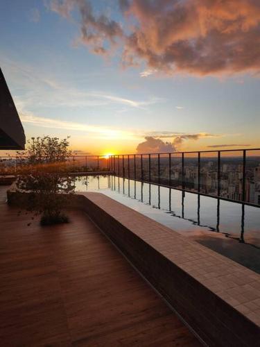 a view of the sunset from a balcony of a building at ID Vida Urbana Setor Oeste Goiânia 3703A in Goiânia