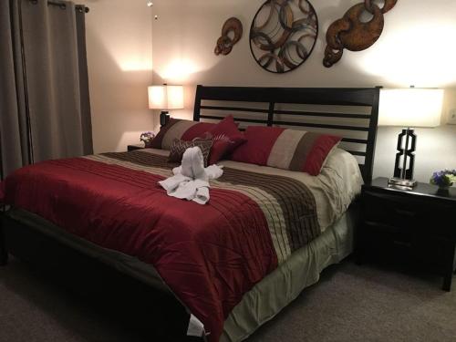 a bedroom with a bed with a stuffed animal on it at Sweet retreat condo resort in Kissimmee