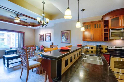 a kitchen and dining room with a table and chairs at Infinity Bay Spa & Beach Resort in West Bay