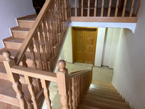 a wooden staircase with a wooden door at GARRIOTT TBILISI in Tbilisi City