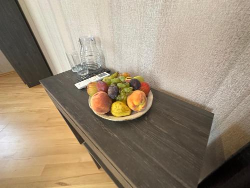 a plate of fruit sitting on a table at GARRIOTT TBILISI in Tbilisi City