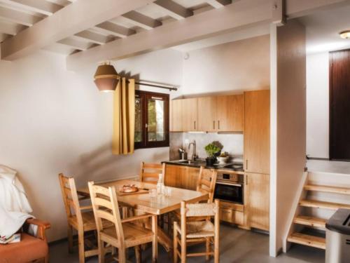 a kitchen with a table and chairs in a room at Maison Corrençon-en-Vercors, 4 pièces, 7 personnes - FR-1-515-182 in Corrençon-en-Vercors