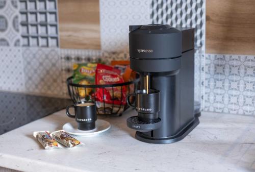a coffee maker on a counter in a kitchen at Casa Mare e Olio by All About Paxos in Gaios