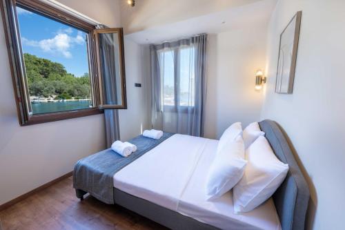 Postel nebo postele na pokoji v ubytování Casa Mare e Olio by All About Paxos