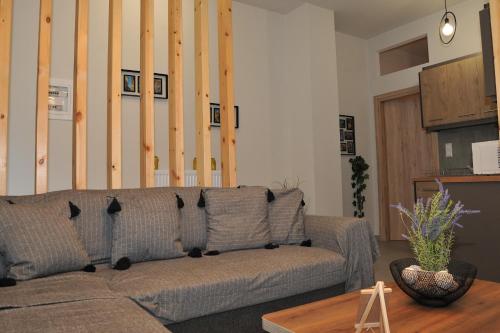a living room with a couch and a table at Meteora's unique gem in Kastrákion