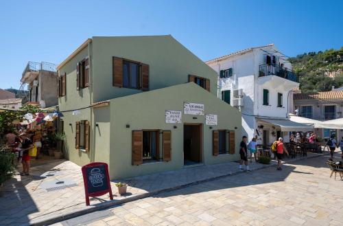 a group of people standing outside of a building at Casa Mare e Olio by All About Paxos in Gaios