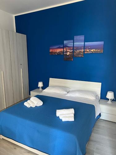 Ένα ή περισσότερα κρεβάτια σε δωμάτιο στο punto house leopardi