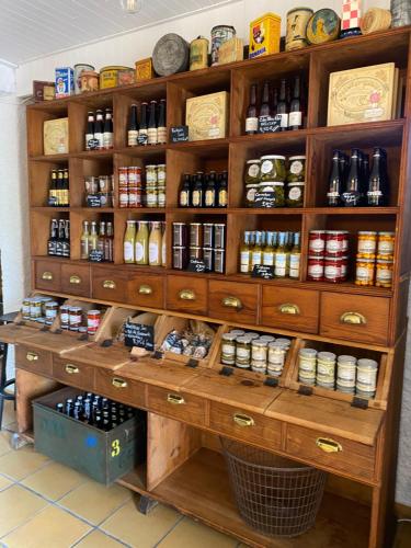 a shelf filled with lots of food and spices at Camping De La Sarre in Abreschviller