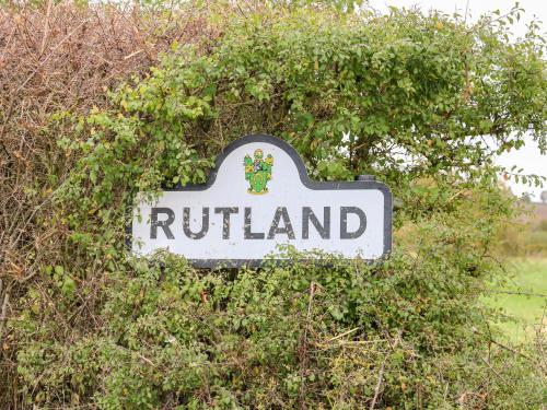 a sign for aroth island in a bush at Hambleton in Cottesmore