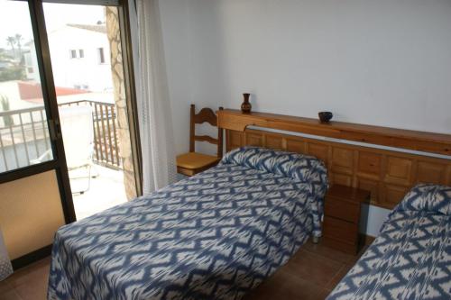 Posteľ alebo postele v izbe v ubytovaní Emporium - apartamento
