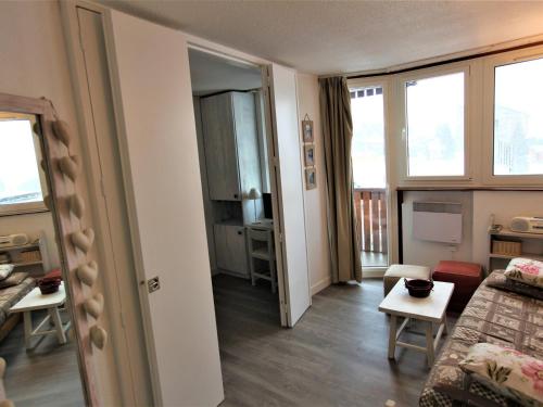a small living room with a couch and a table at Appartement Avoriaz, 2 pièces, 4 personnes - FR-1-314-190 in Morzine