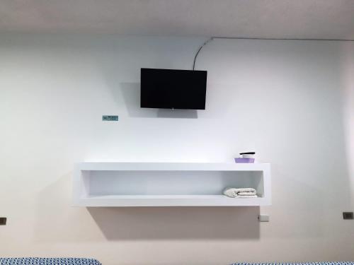 Hotel Posada Los Faroles Atlixcoにあるテレビまたはエンターテインメントセンター