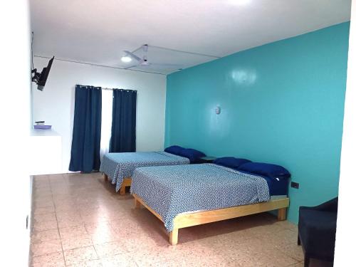 Hotel Posada Los Faroles Atlixcoにあるベッド
