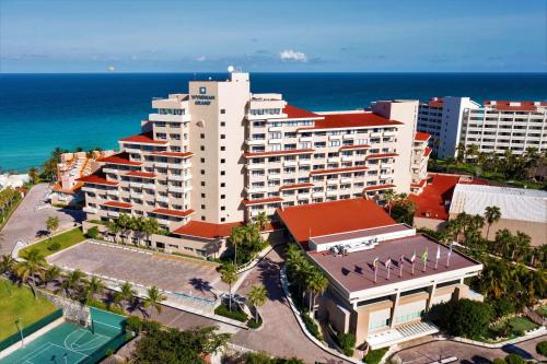 an aerial view of a resort in front of the ocean at Wyndham Grand Cancun All Inclusive Resort & Villas in Cancún