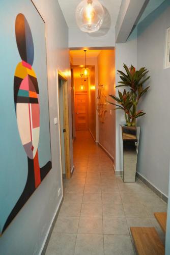 a hallway with a painting of a rabbit on the wall at Hostal 53 Boutique Santo Domingo in Santo Domingo