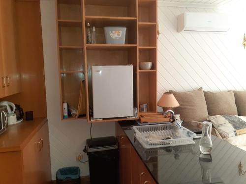 a kitchen with a desk with a computer on it at Karsen residence in Cape Town
