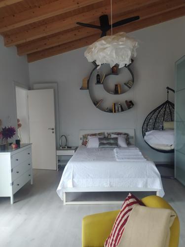 a bedroom with a bed and a ceiling fan at Habitaciones con encanto 