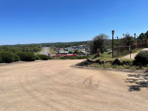 an empty parking lot with a road in the distance at Quality Inn Clinton North in Clinton