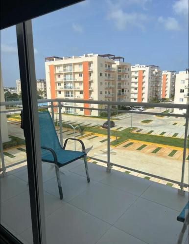 a blue chair sitting on top of a balcony at Sweet home in Punta Cana
