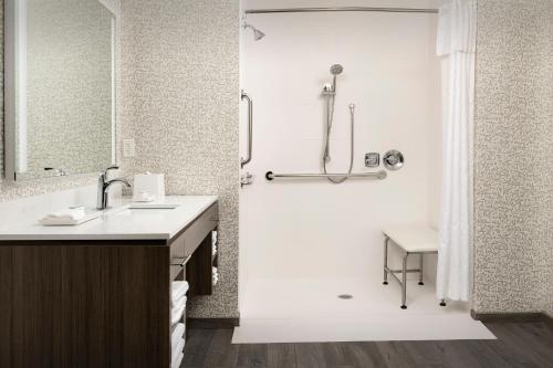 a bathroom with a sink and a shower at Home2 Suites By Hilton Kenner New Orleans Arpt in Kenner
