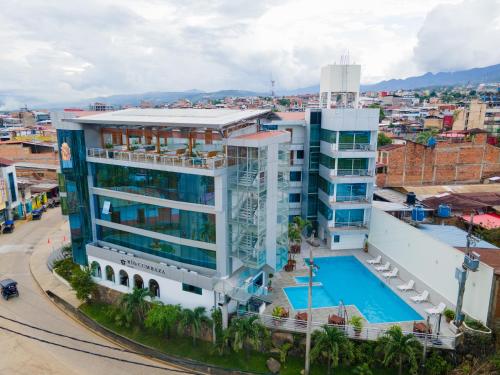 an aerial view of a building with a swimming pool at Rio Cumbaza Hotel in Tarapoto