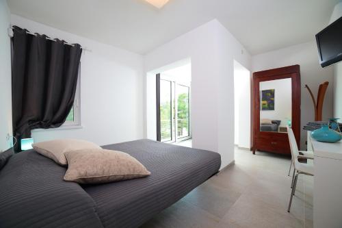 Ένα ή περισσότερα κρεβάτια σε δωμάτιο στο AgriturismoB&B Loggia Degli Artisti
