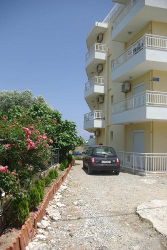 a car parked in front of a building at Yiannis Apartments in Rhodes Town