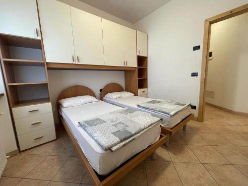 Postel nebo postele na pokoji v ubytování Casa Adamello Giustino