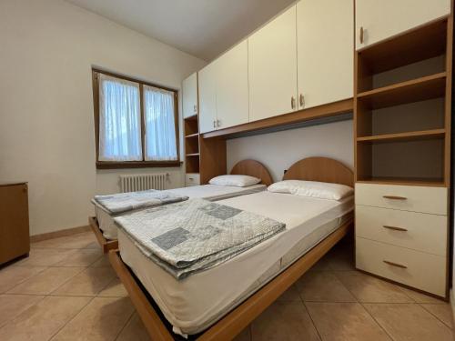 Postel nebo postele na pokoji v ubytování Casa Adamello Giustino