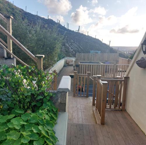 a balcony with a view of a hill at Tobar Na Si Apartments in Letterkenny