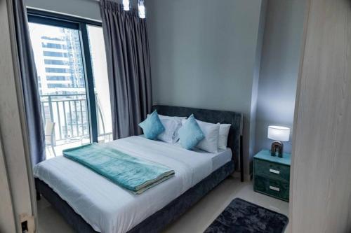 Postel nebo postele na pokoji v ubytování New 1BR close to Burj Khalifa