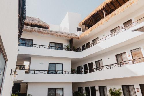 a view of the balconies of a building at HAU Holbox, Oceanfront Boutique Hotel in Holbox Island