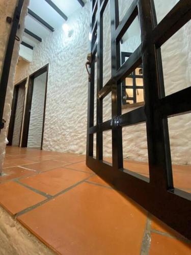 an open door to a room with a floor and a wall at Casatoca House Zapatoca Lengerke in Zapatoca