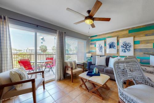 a living room with a couch and chairs at Marvilla Condo My Happy Place in Galveston