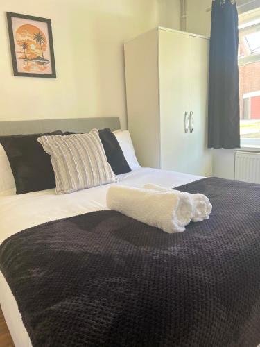 Ένα ή περισσότερα κρεβάτια σε δωμάτιο στο The Ultimate Home Away from Home