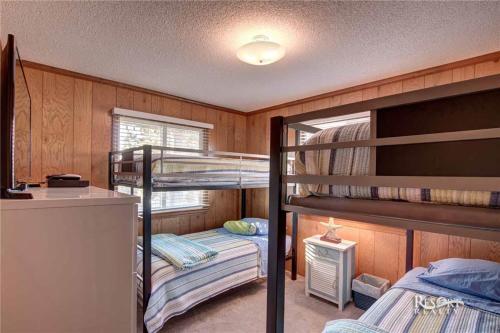 a bunk bed room with two bunk beds in it at 6058 - Are U Shore by Resort Realty in Nags Head