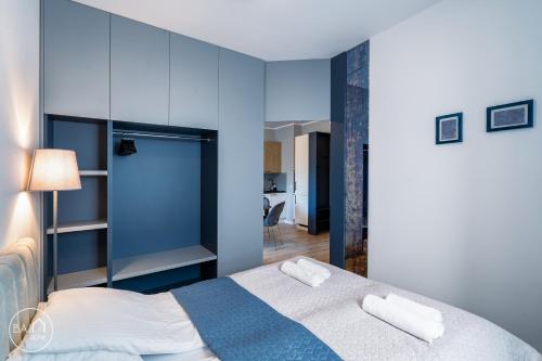 Ένα ή περισσότερα κρεβάτια σε δωμάτιο στο Blue Harmony Apartment