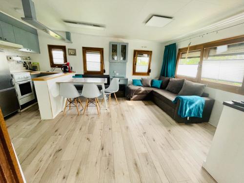 a living room with a couch and a table at FeWo-Krone in Heringsdorf